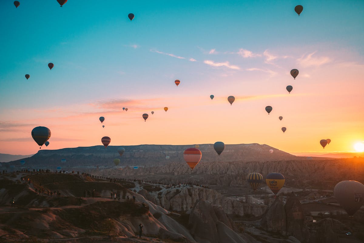 Cappadocia rooftop view with balloons in the sky